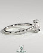 Kynora CJ 2ct round claw solitaire engagement ring with hidden halo and floating cathedral low setting, sparkling diamond design.