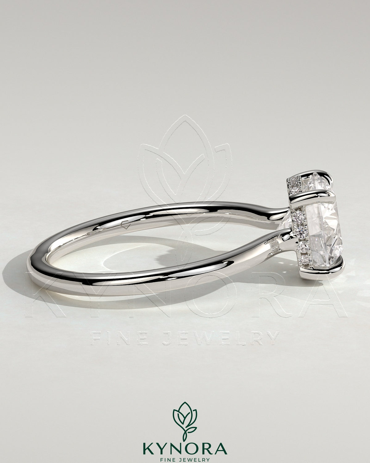 Kynora CJ 2ct round claw solitaire engagement ring with hidden halo and floating cathedral low setting, sparkling diamond design.
