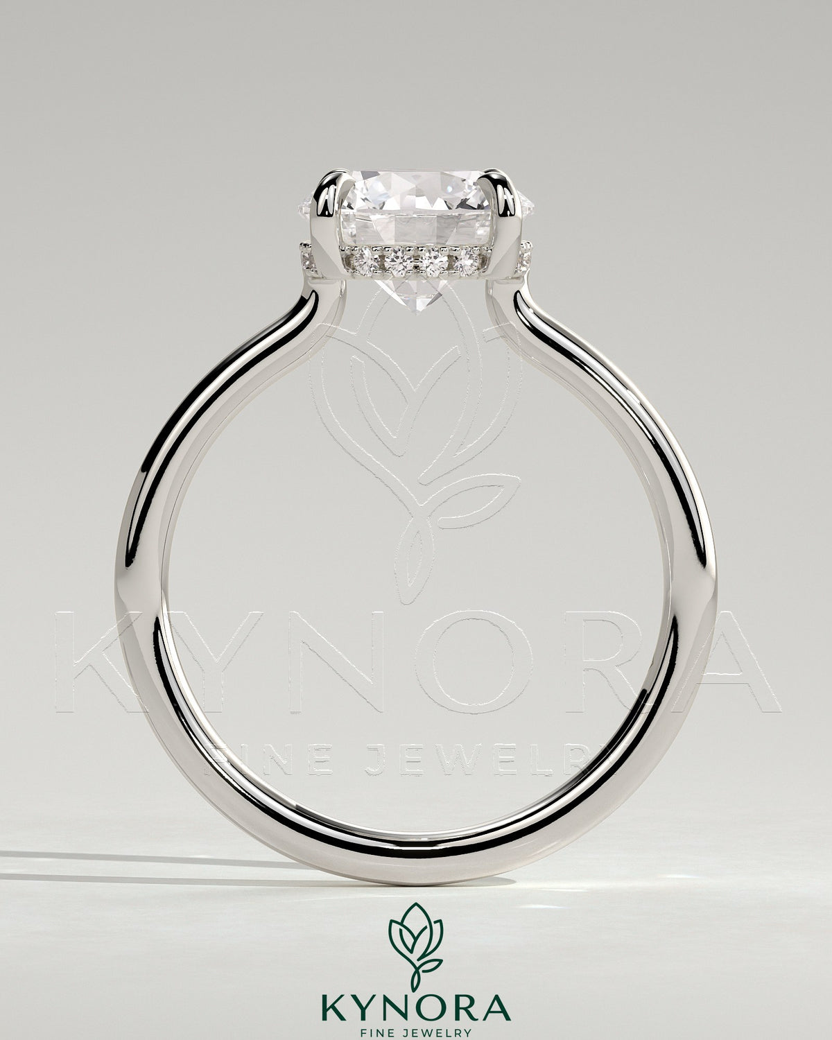 Kynora CJ 2ct round claw solitaire engagement ring with hidden halo and floating cathedral low setting, showcasing elegant jewelry design
