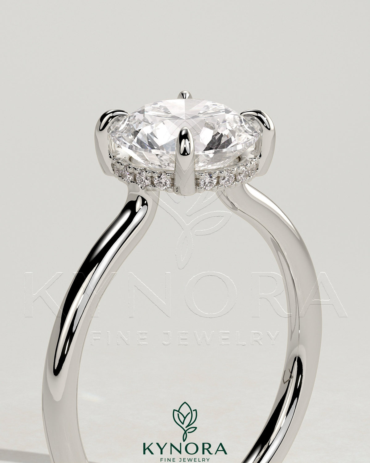 Kynora CJ 2ct round claw solitaire engagement ring with hidden halo and floating cathedral low setting, showcasing diamond details.