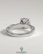 Kynora CJ 2ct round claw solitaire engagement ring with hidden halo and twisted pave band, showcasing elegant diamond details.