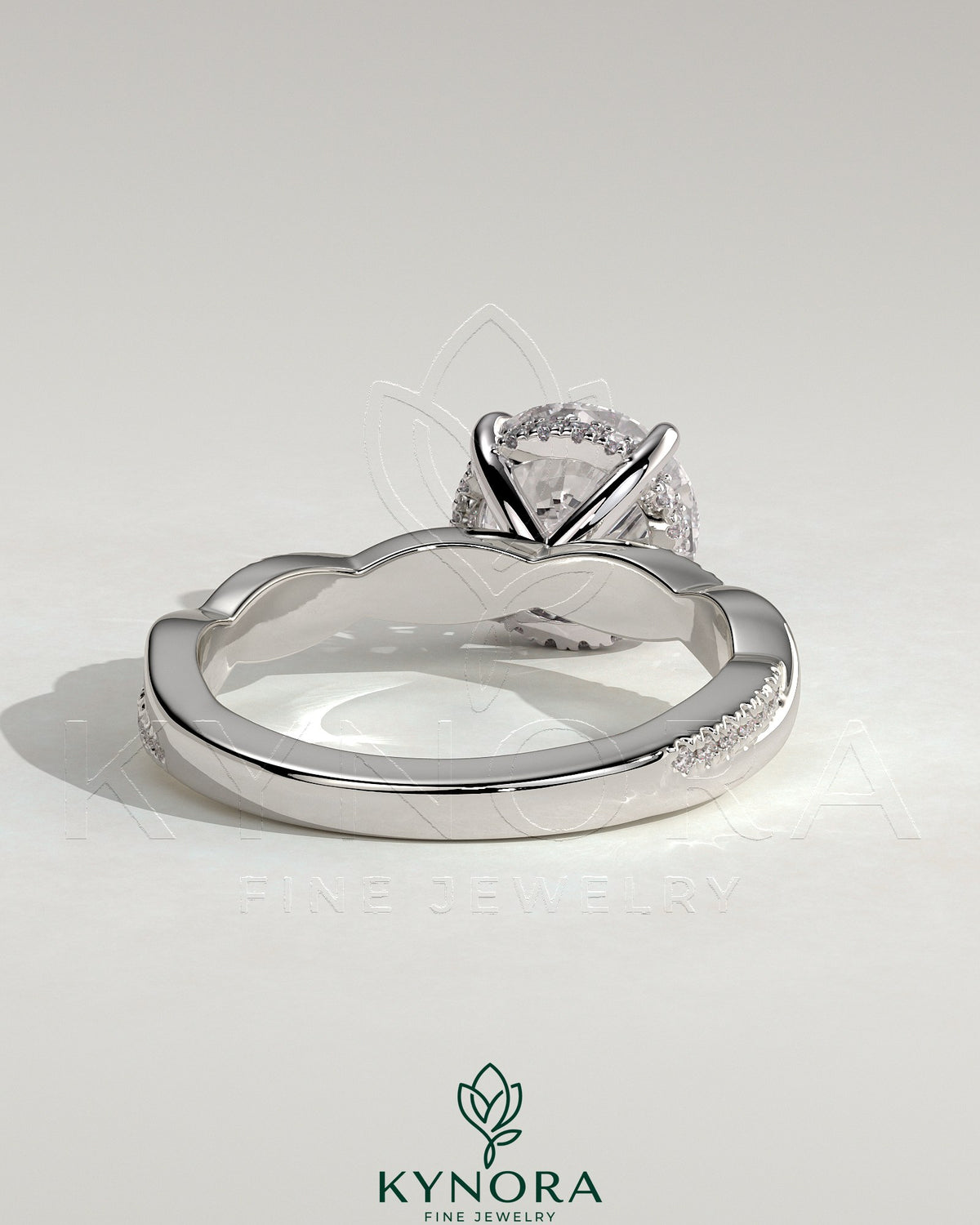 Kynora CJ 2ct round claw solitaire engagement ring with hidden halo and twisted pave band, showcasing elegant diamond details.