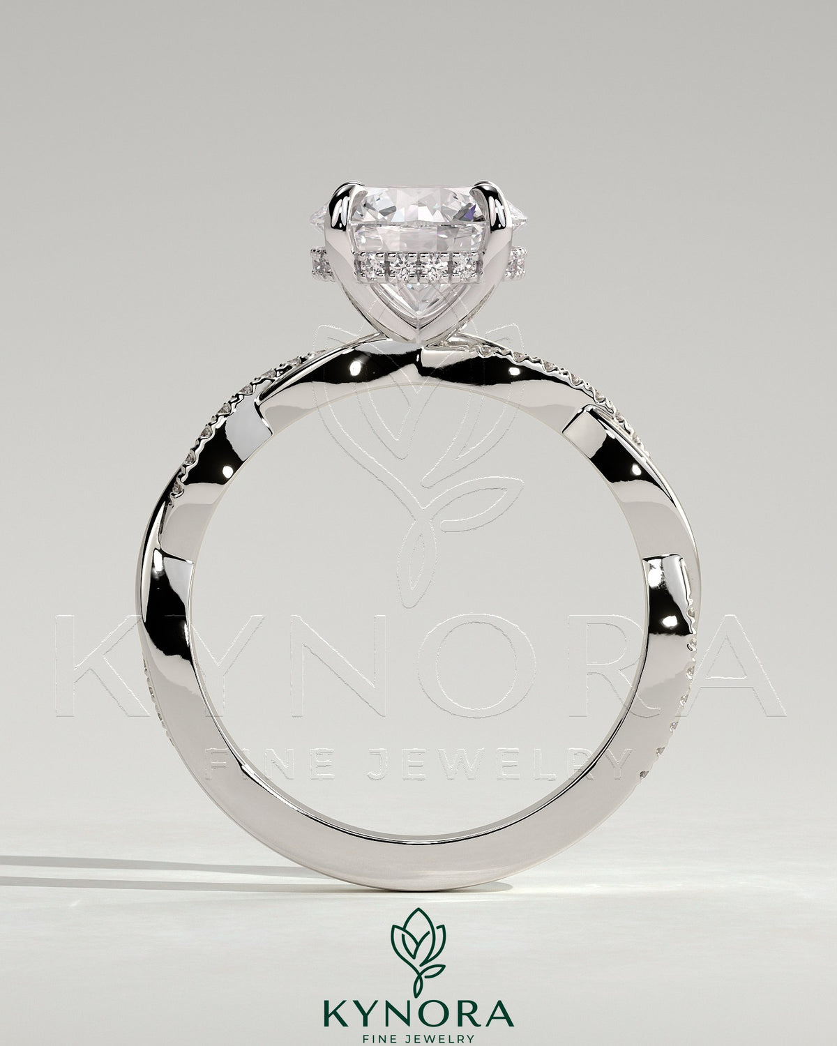 Kynora CJ 2ct round claw solitaire engagement ring with hidden halo and twisted pave band, crafted in sterling silver.