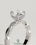 Kynora CJ 2ct round claw solitaire engagement ring with hidden halo and twisted pave band, showcasing elegant diamond details.