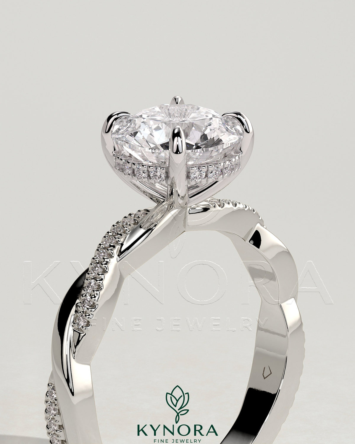 Kynora CJ 2ct round claw solitaire engagement ring with hidden halo and twisted pave band, showcasing elegant diamond details.