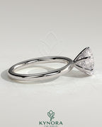 Kynora CJ 2-carat round claw solitaire engagement ring with hidden halo, featuring a sparkling central diamond and elegant design.