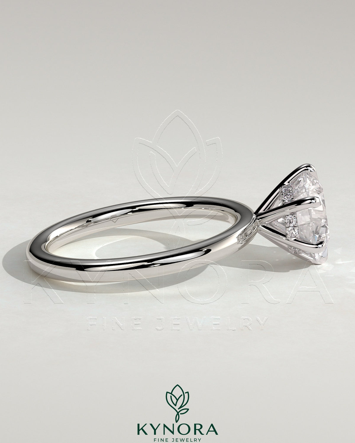 Kynora CJ 2-carat round claw solitaire engagement ring with hidden halo, featuring a sparkling central diamond and elegant design.
