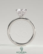 Kynora CJ 2ct round claw solitaire engagement ring with a hidden halo, featuring a sparkling central diamond and elegant band.
