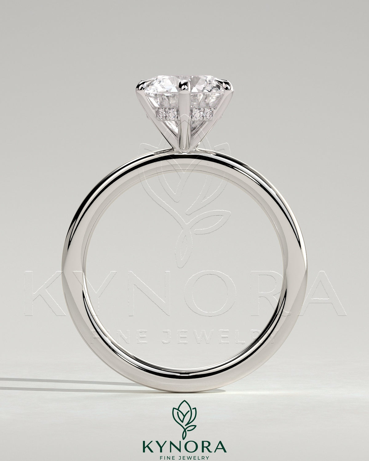Kynora CJ 2ct round claw solitaire engagement ring with a hidden halo, featuring a sparkling central diamond and elegant band.