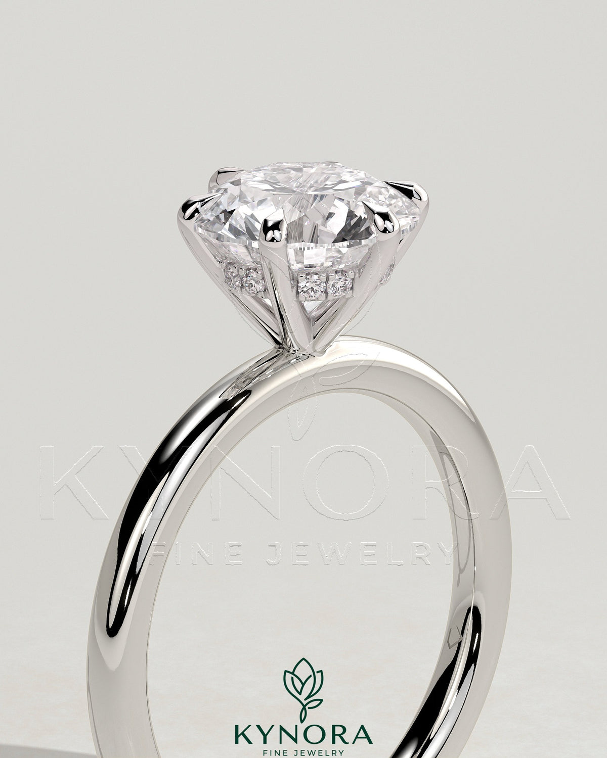Kynora CJ 2ct round claw solitaire engagement ring with hidden halo, showcasing a sparkling central diamond and elegant design