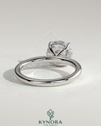 Kynora CJ 2ct round claw solitaire engagement ring with hidden halo, featuring a sparkling center diamond and elegant design.
