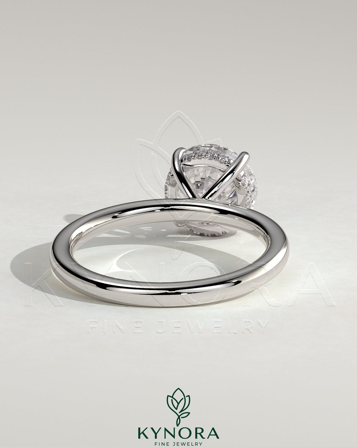 Kynora CJ 2ct round claw solitaire engagement ring with hidden halo, featuring a sparkling center diamond and elegant design.
