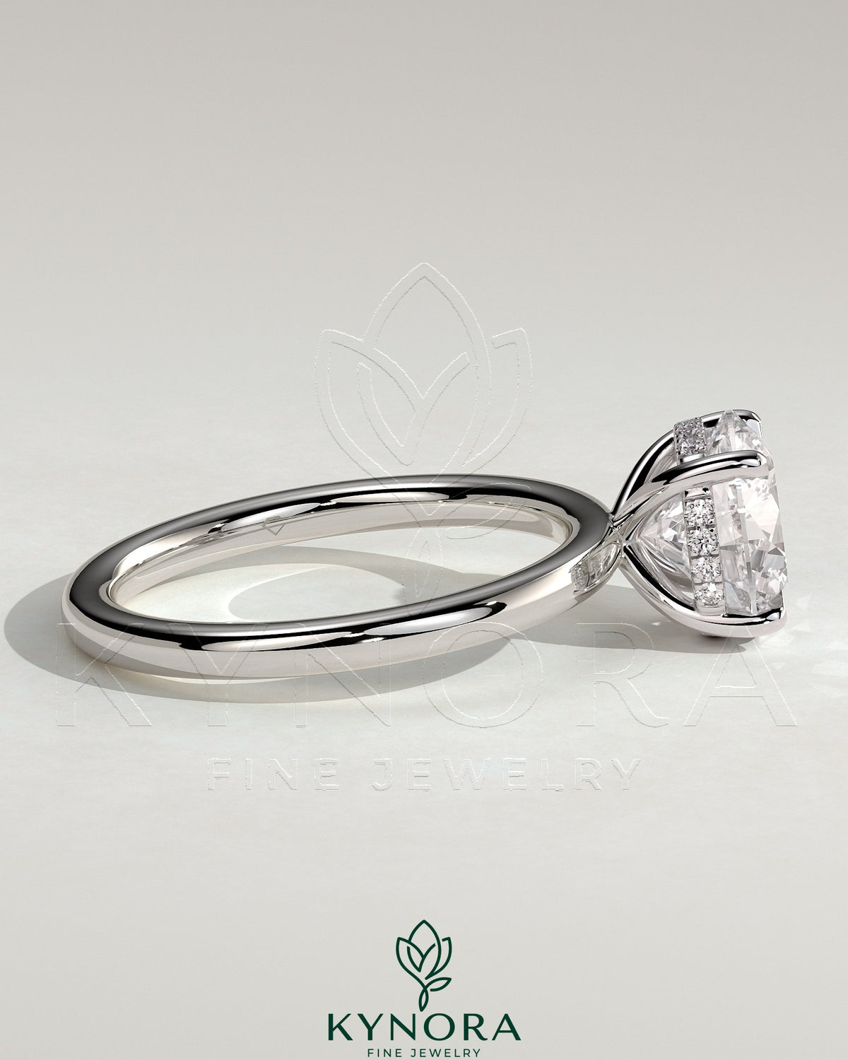 Kynora CJ 2ct round cut solitaire engagement ring with hidden halo, featuring a sleek platinum band and sparkling center stone.