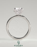 Kynora CJ 2ct round claw solitaire engagement ring with hidden halo, featuring a sparkling central diamond and elegant design.