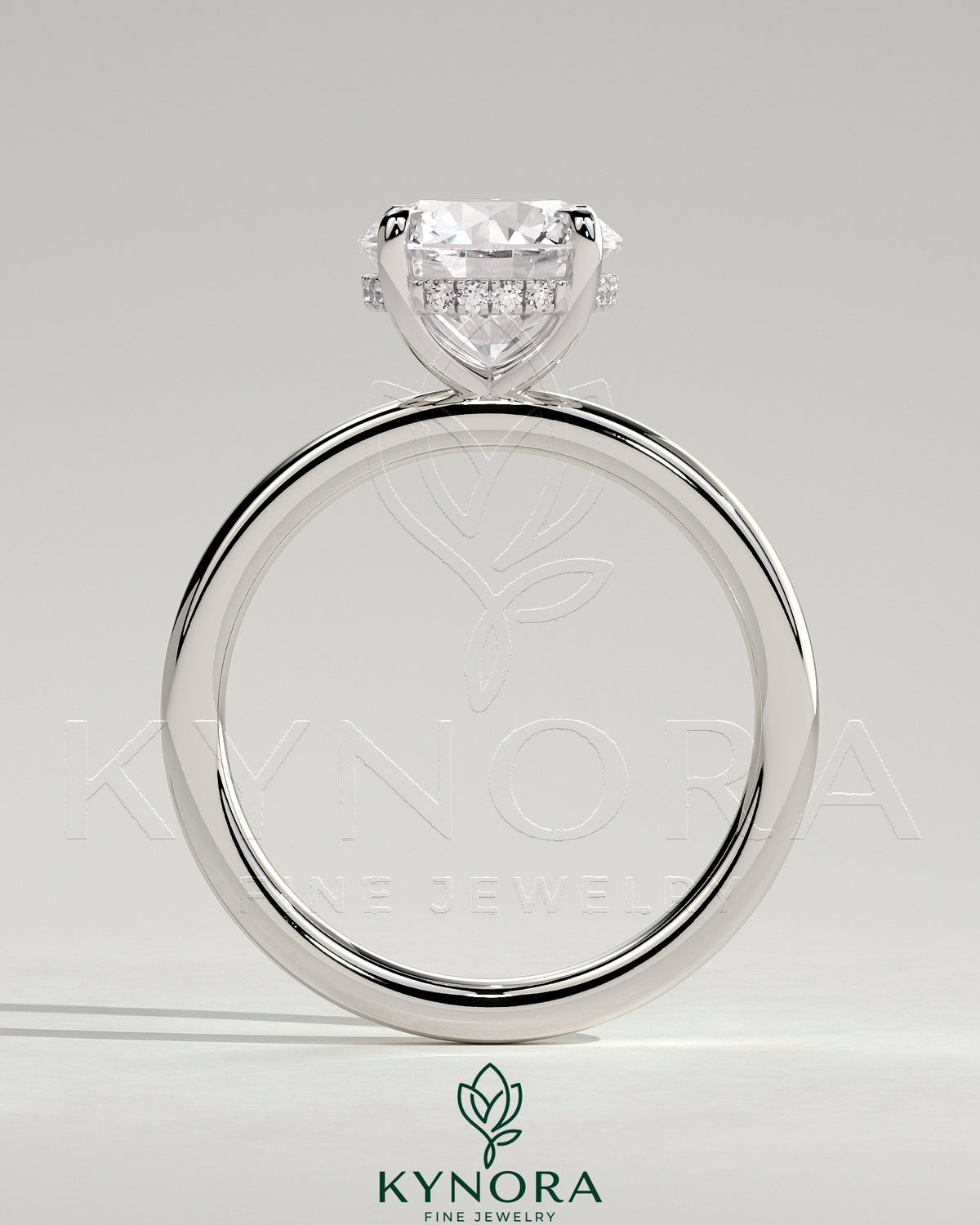 Kynora CJ 2ct round claw solitaire engagement ring with hidden halo, featuring a sparkling central diamond and elegant design.