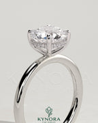 Kynora CJ 2ct round claw solitaire engagement ring with hidden halo, featuring a sparkling central diamond and elegant design.