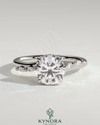 Kynora CJ 2ct round claw solitaire engagement ring with hidden halo, marquise accents, cathedral high setting, jewelry image