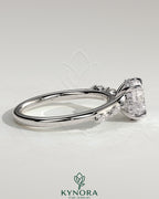 Kynora CJ 2ct round claw solitaire engagement ring with hidden halo, marquise accents, and cathedral setting.
