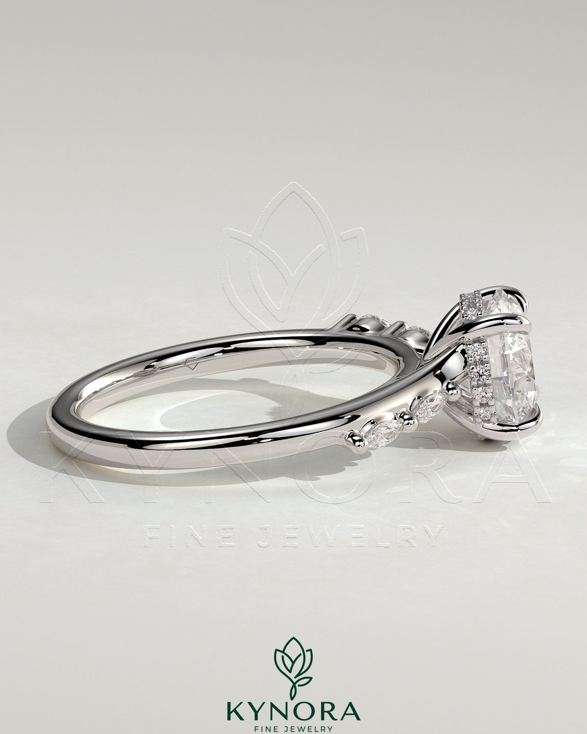 Kynora CJ 2ct round claw solitaire engagement ring with hidden halo, marquise accents, and cathedral setting.