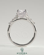 Kynora CJ 2ct round claw solitaire engagement ring with hidden halo, opposing marquise accents, cathedral high setting.