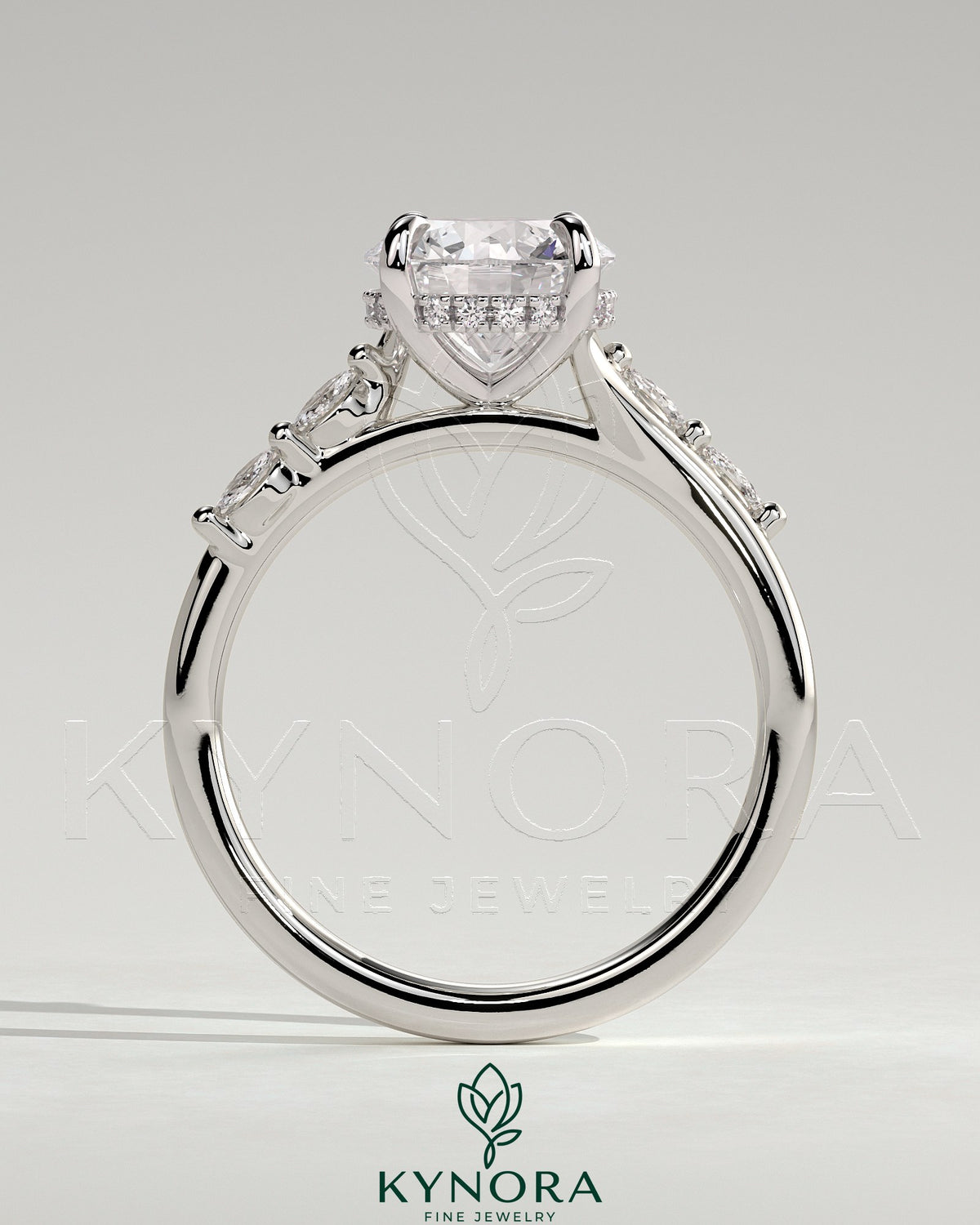 Kynora CJ 2ct round claw solitaire engagement ring with hidden halo, opposing marquise accents, cathedral high setting.