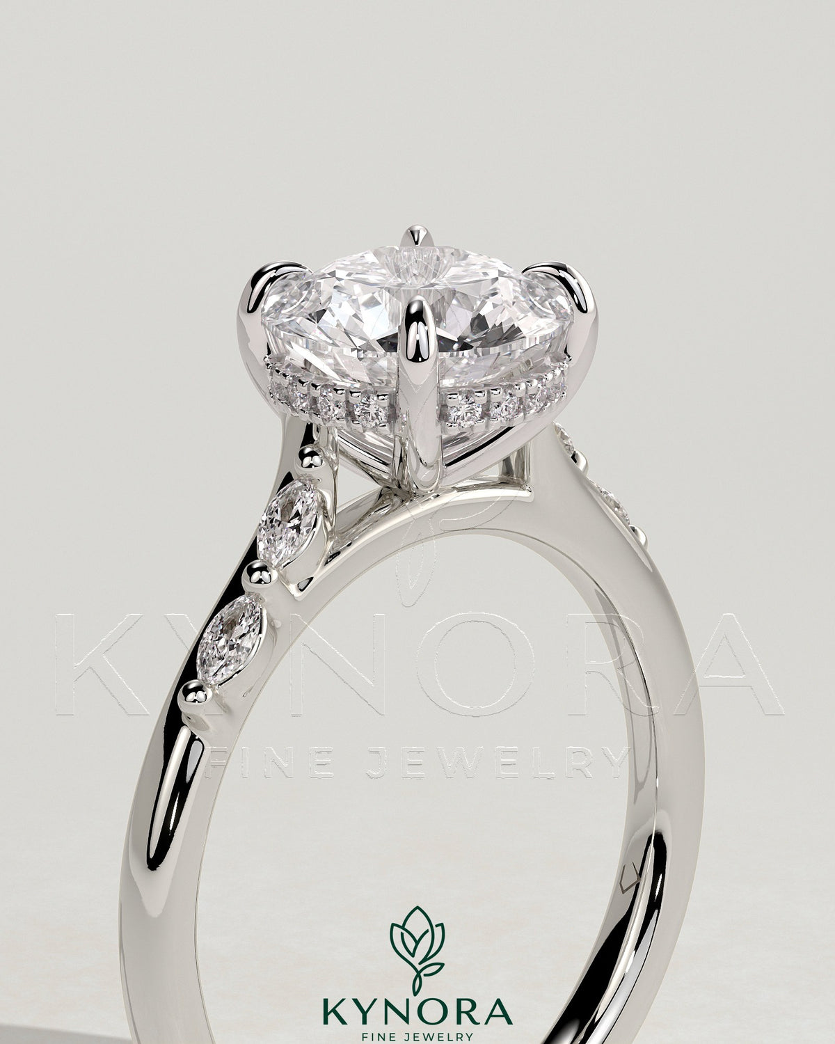 Kynora CJ 2ct round claw solitaire engagement ring with hidden halo, marquise accents, and cathedral high setting.