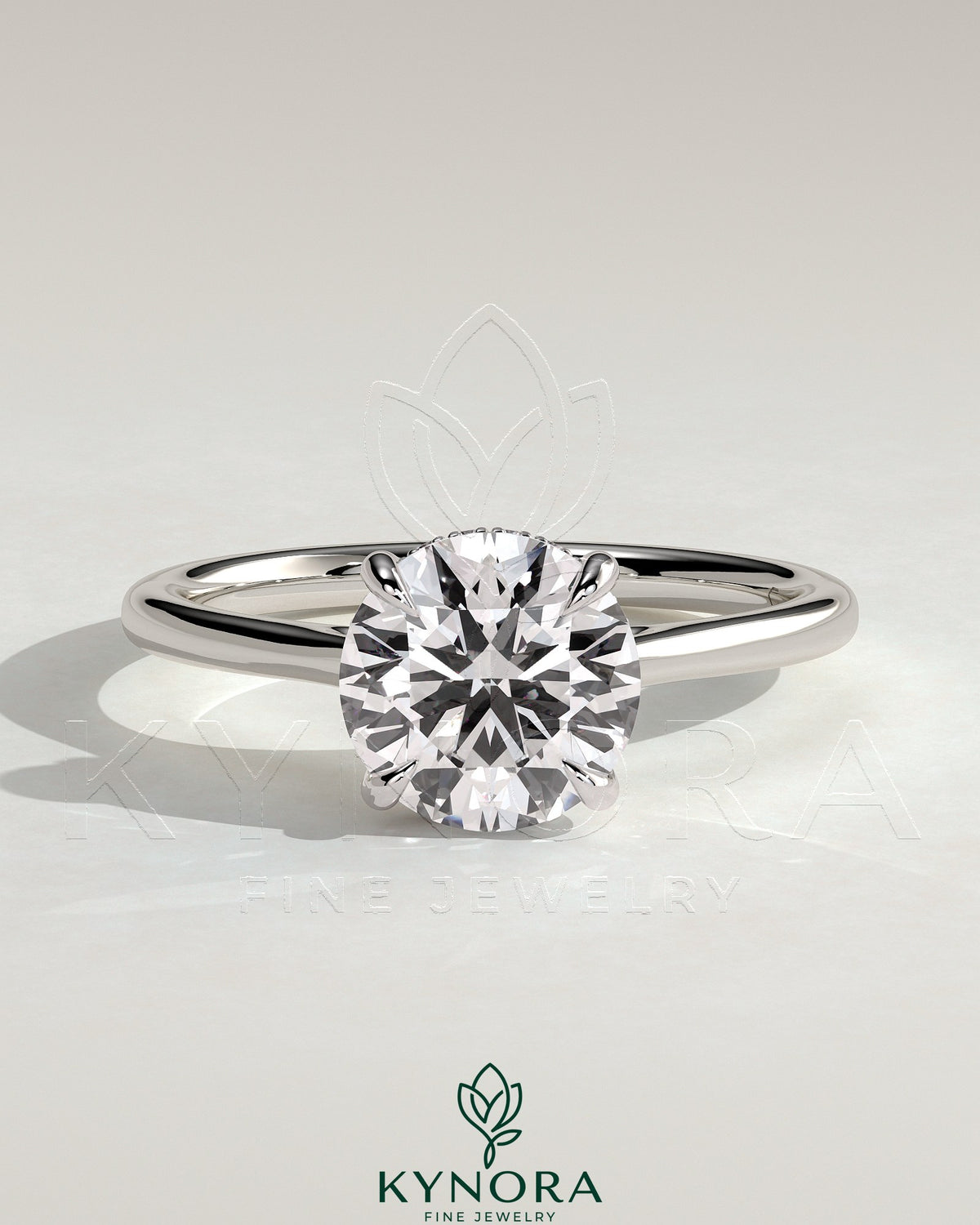 Kynora CJ 2ct round claw solitaire engagement ring with hidden halo, tapered band, and cathedral high setting.