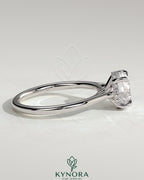 Kynora CJ 2ct round claw solitaire engagement ring with hidden halo, tapered band, and cathedral high setting.