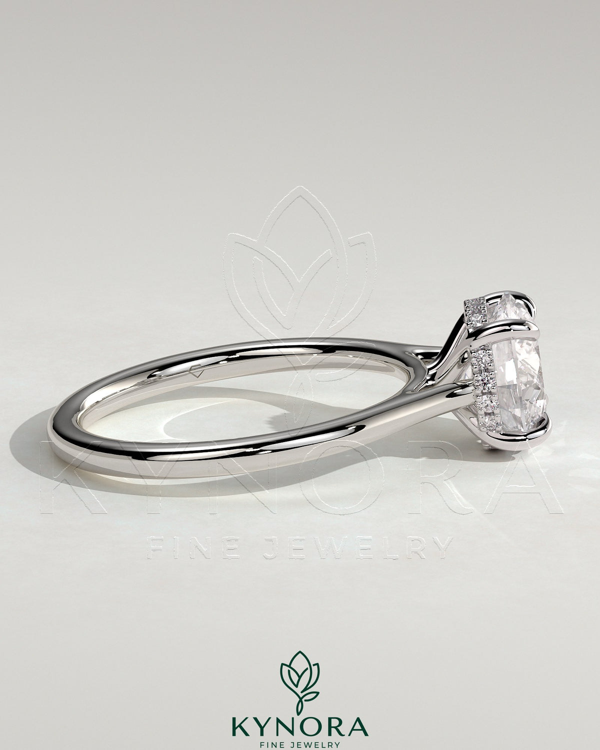 Kynora CJ 2ct round claw solitaire engagement ring with hidden halo, tapered band, and cathedral high setting.