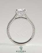 Kynora CJ 2ct round claw solitaire engagement ring with hidden halo, triple pave band, and cathedral high setting.