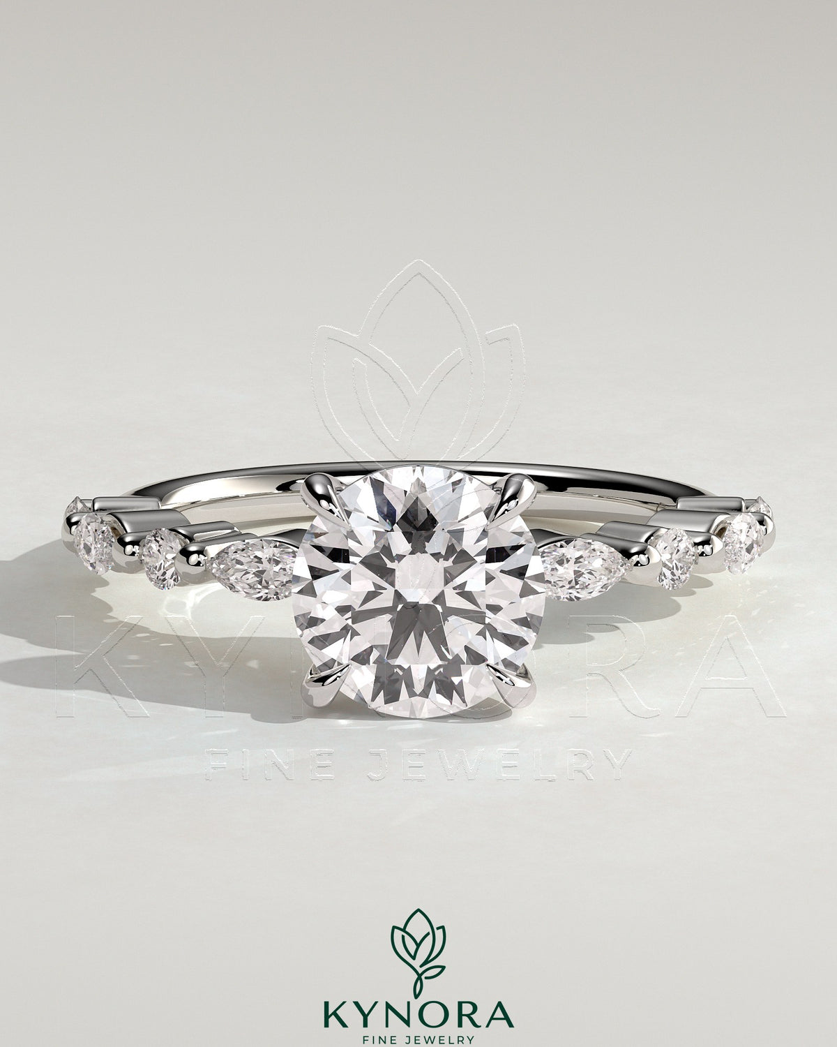 Kynora CJ 2ct round claw solitaire engagement ring with marquise and round accent stones, elegant and sparkling jewelry piece.