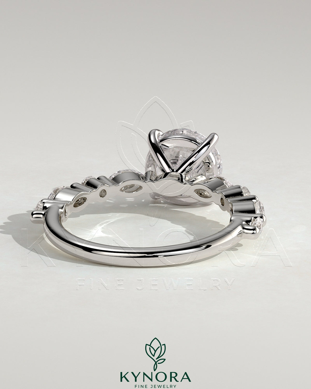 Kynora CJ 2ct round claw solitaire engagement ring with marquise and round accent stones, elegant jewelry for special occasions