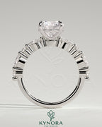 Kynora CJ 2ct round claw solitaire engagement ring with marquise and round accent stones, elegant and sparkling jewelry piece.