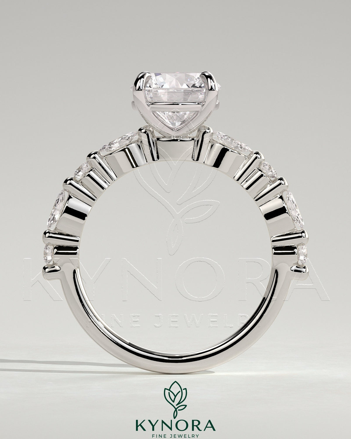 Kynora CJ 2ct round claw solitaire engagement ring with marquise and round accent stones, elegant and sparkling jewelry piece.