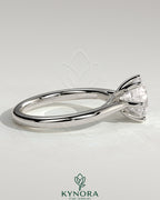 Kynora CJ 2ct round claw solitaire engagement ring with open trellis gallery and cathedral low setting, showcasing elegant craftsmanship.