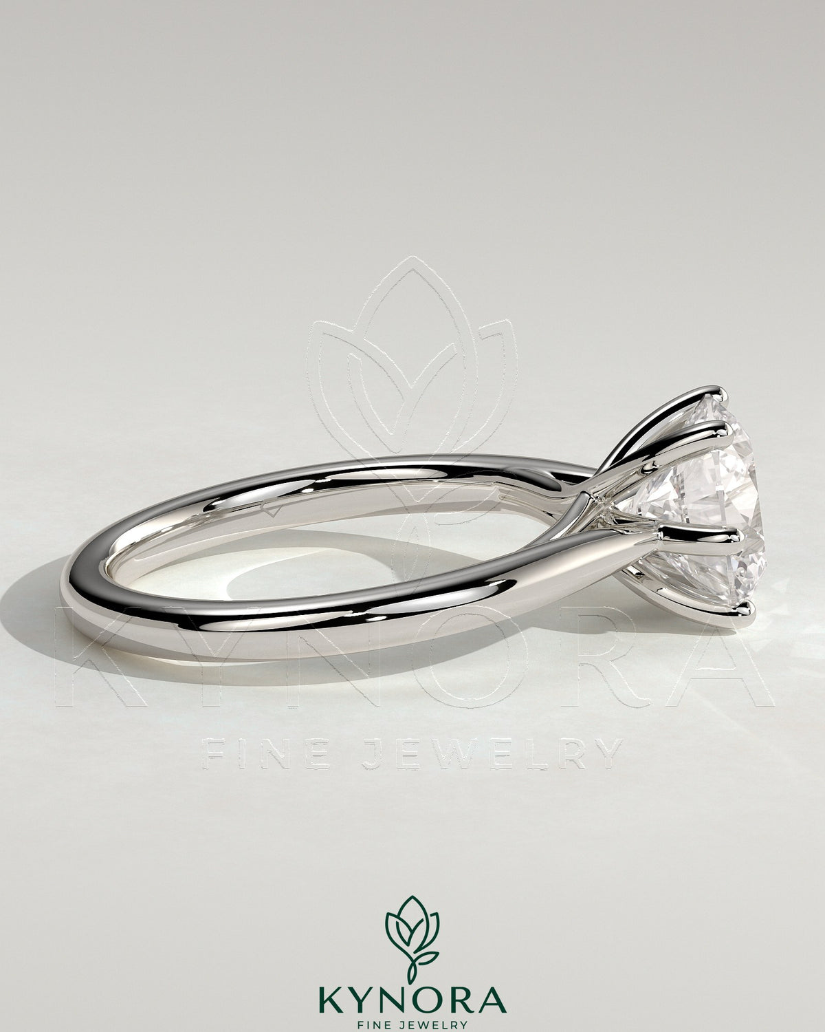 Kynora CJ 2ct round claw solitaire engagement ring with open trellis gallery and cathedral low setting, showcasing elegant craftsmanship.