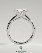 Kynora CJ 2ct round diamond solitaire engagement ring with open trellis gallery and cathedral low setting.
