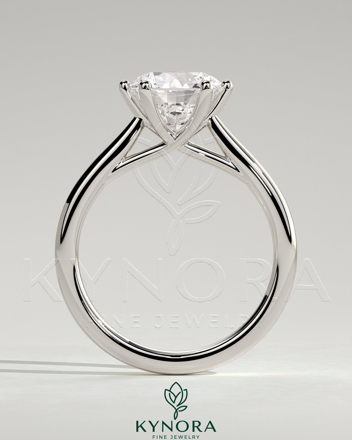 Kynora CJ 2ct round diamond solitaire engagement ring with open trellis gallery and cathedral low setting.