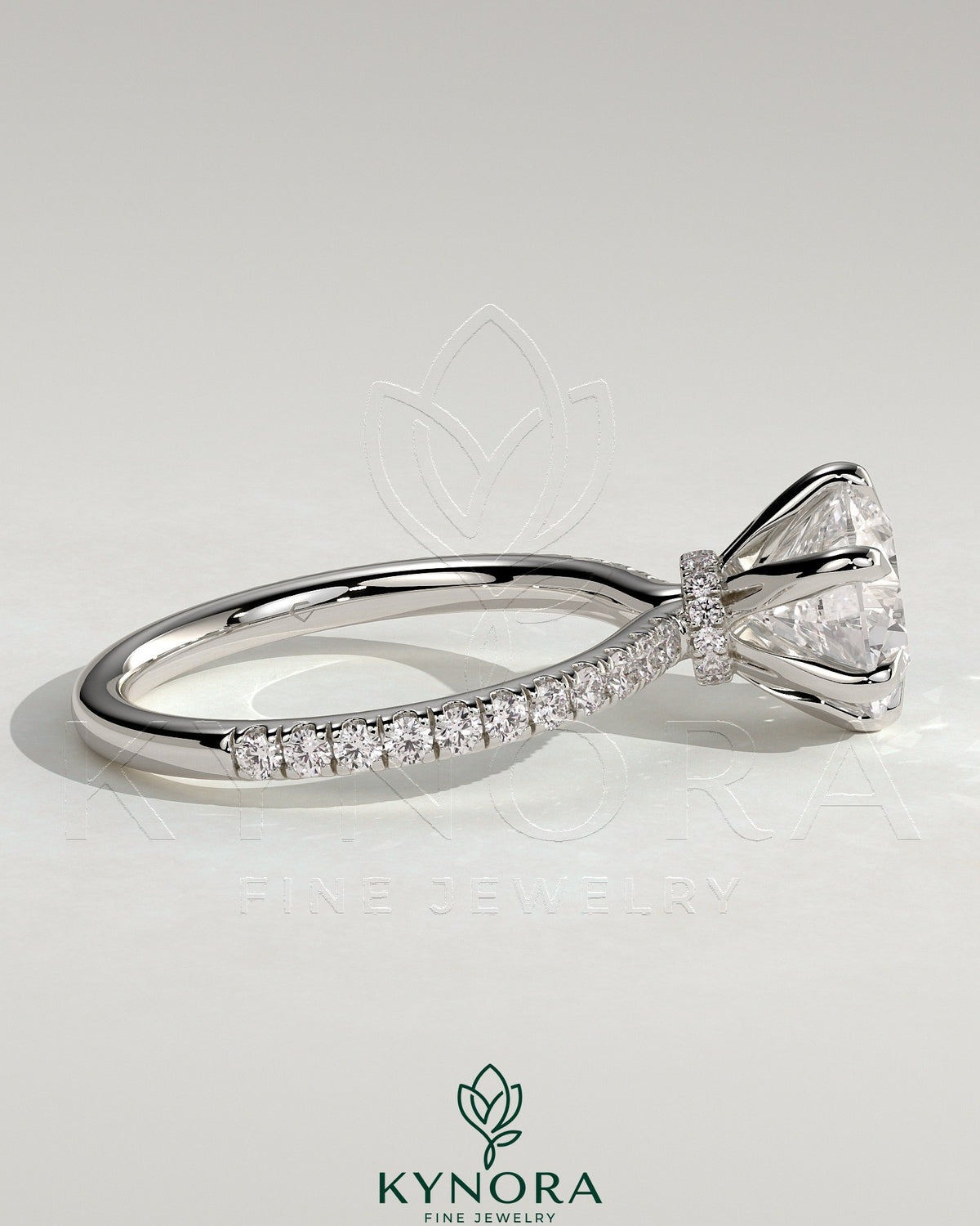 Kynora CJ 2ct round claw solitaire engagement ring with pave band and pave collar, showcasing elegant diamond setting.