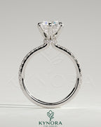 Kynora CJ 2ct round cut solitaire engagement ring with pave band and pave collar, showcasing sparkling diamond design.