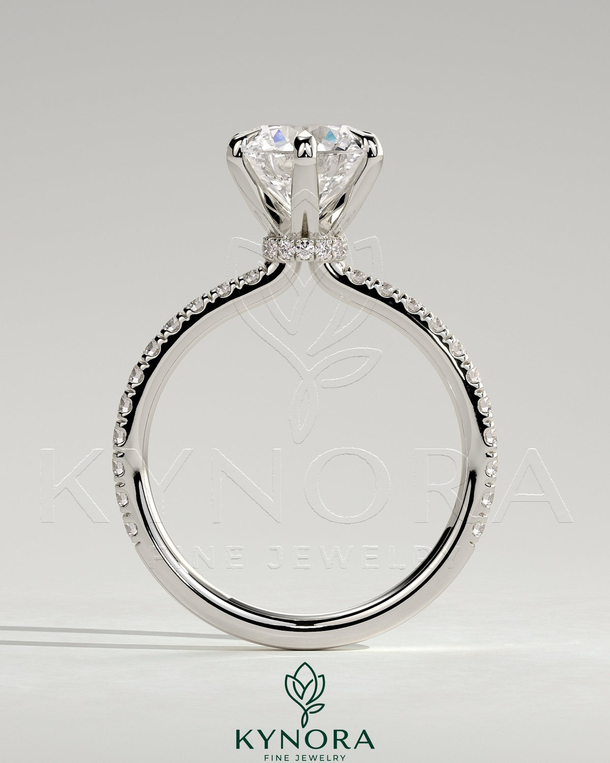 Kynora CJ 2ct round cut solitaire engagement ring with pave band and pave collar, showcasing sparkling diamond design.