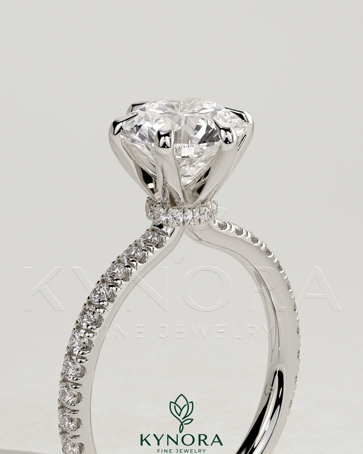 Kynora CJ 2ct round diamond solitaire engagement ring with pave band and collar setting, showcasing elegant craftsmanship and sparkle.