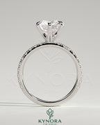 Kynora CJ 2ct round diamond claw solitaire engagement ring with pave band, showcasing elegant design and sparkling gemstones.