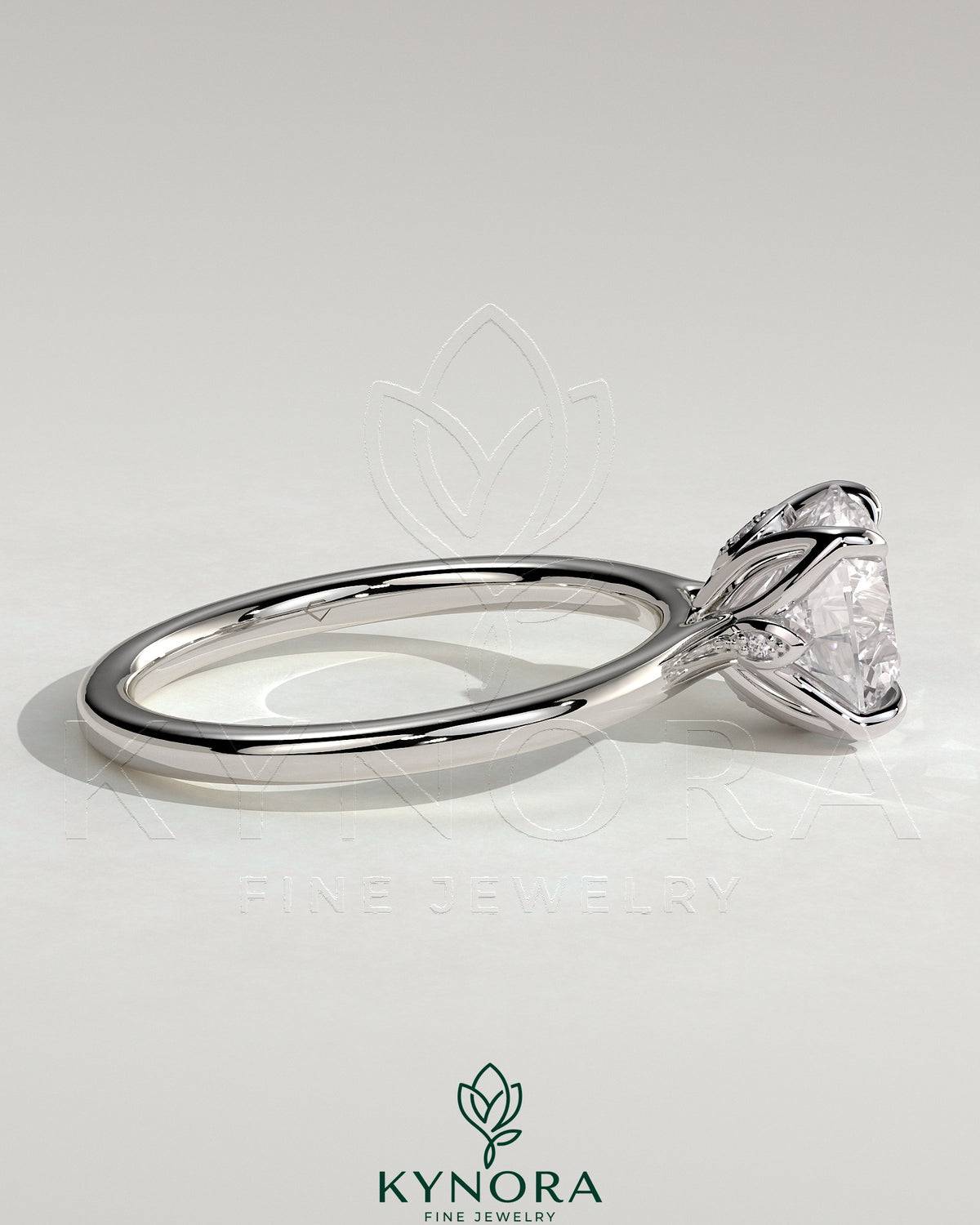 Kynora CJ 2ct round claw solitaire engagement ring with petal gallery, leaf accents, and cathedral setting.