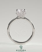 Kynora CJ 2ct round claw solitaire engagement ring with petal gallery, leaf accents, and cathedral setting, showcasing elegant design.