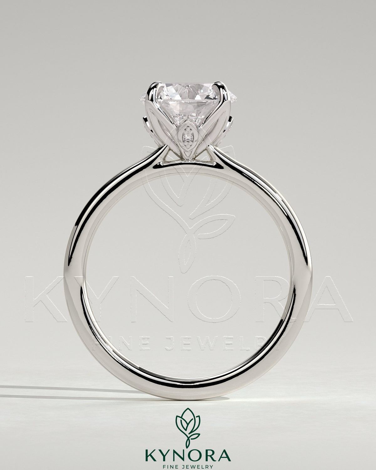Kynora CJ 2ct round claw solitaire engagement ring with petal gallery, leaf accents, and cathedral setting, showcasing elegant design.