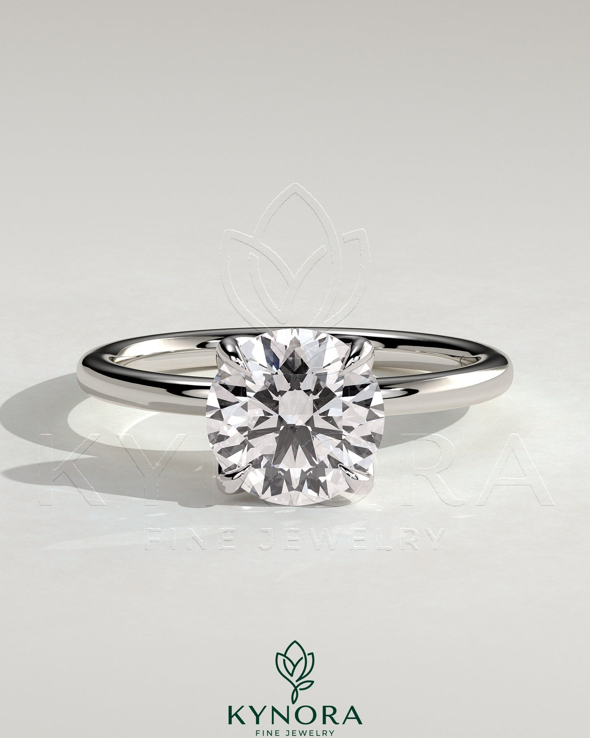Kynora CJ 2ct round claw solitaire engagement ring with petal gallery and leaf accents, showcasing elegant jewelry design.