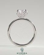 Kynora CJ 2ct round claw solitaire engagement ring with petal gallery and leaf accents in sterling silver.