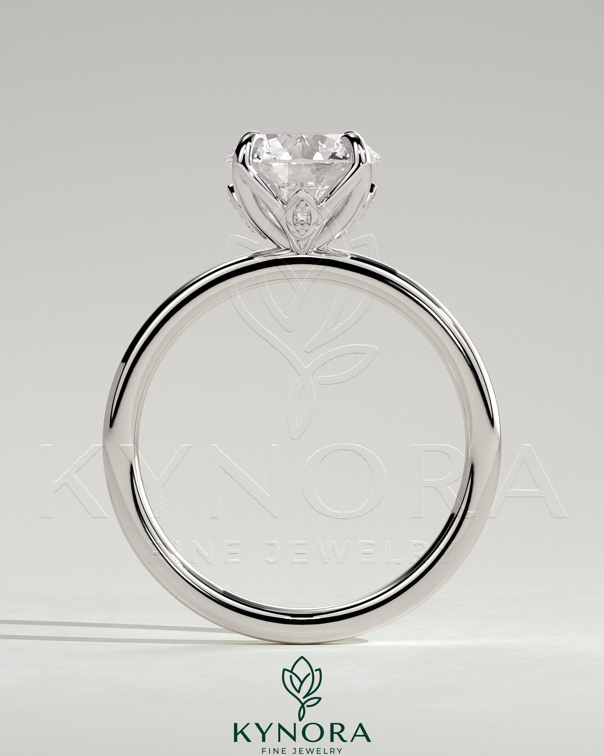 Kynora CJ 2ct round claw solitaire engagement ring with petal gallery and leaf accents in sterling silver.