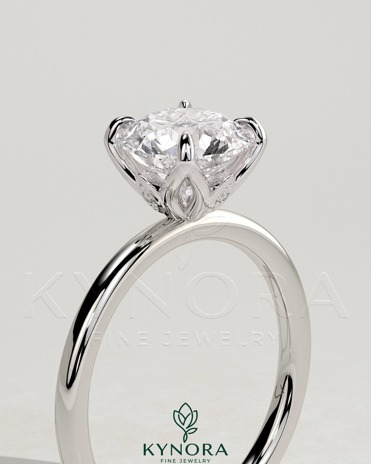 Kynora CJ 2ct round claw solitaire engagement ring with petal gallery and accent leaf details, showcasing elegant jewelry design.
